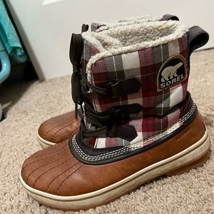 Sorel boots! Cozy plush inside with cute plaid pattern.